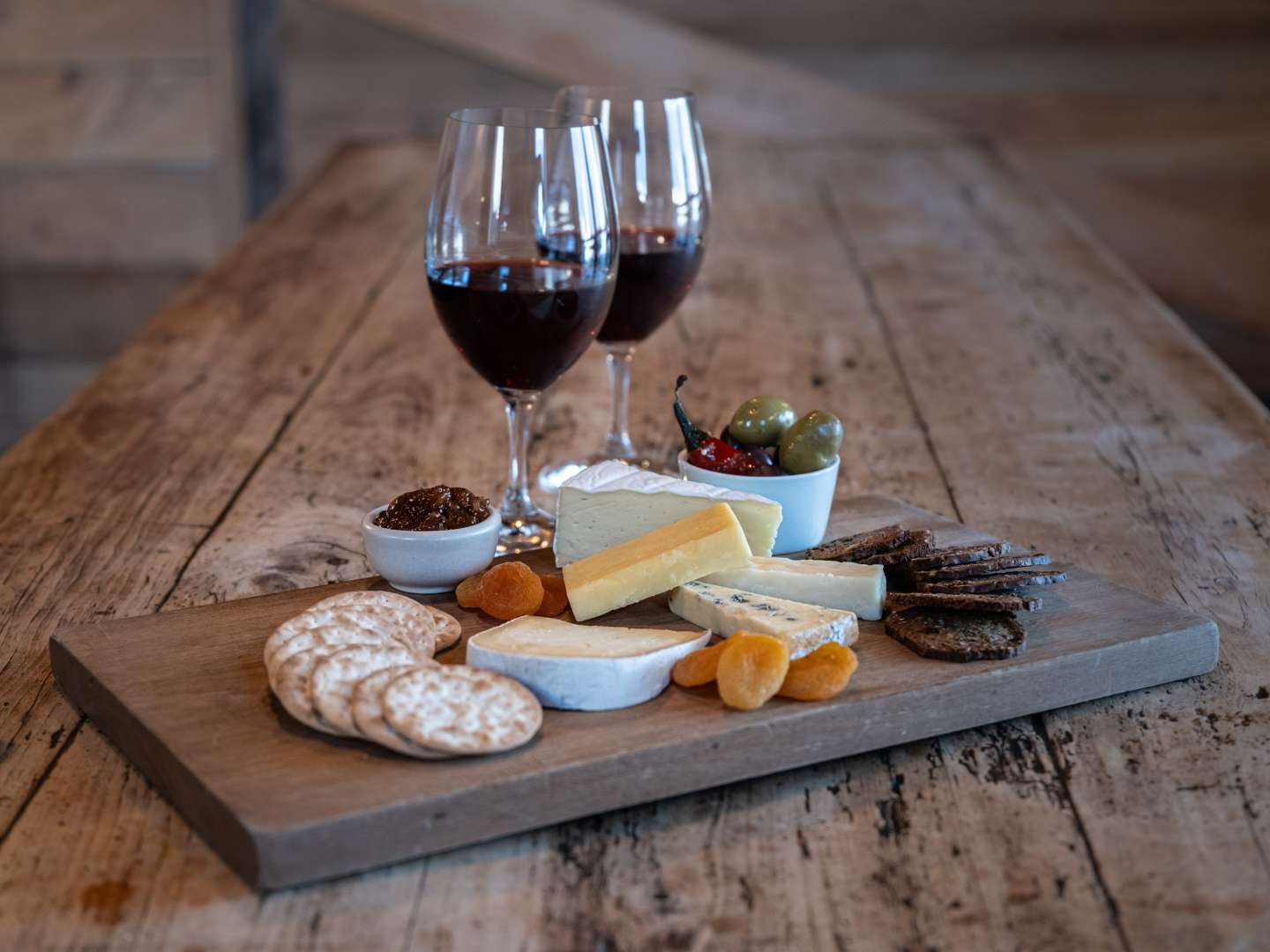 Enjoy a cheeseboard and a unique wine barrel-cooked lunch with matching wines